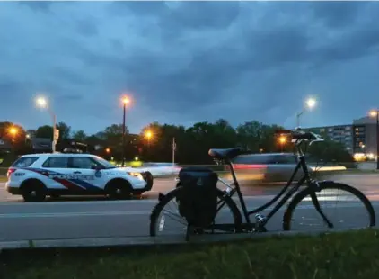  ?? STEVE RUSSELL/TORONTO STAR ?? Police sit at the scene after a 5-year-old boy was struck and killed by a vehicle in Parkdale on Wednesday evening.