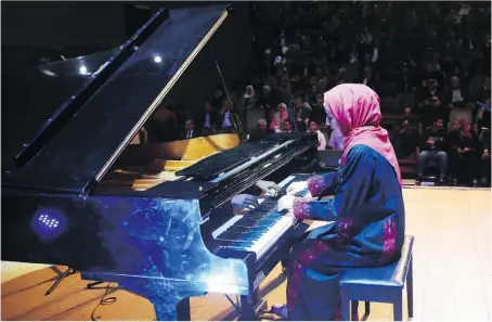  ?? THE ASSOCIATED PRESS ?? Yara Thabit performs during a concert to mark the debut of Gaza’s only grand piano after it was saved from conflict.