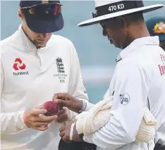  ?? Picture: WILLIAM WEST/AFP ?? ALL GOOD: England captain Joe Root and umpire Kumar Dharmasena at the MCG yesterday.