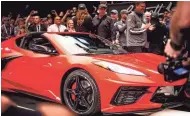  ?? ELI IMADALI/ THE REPUBLIC ?? The first ever mid-engine Corvette, the 2020 Chevrolet C8 Corvette Stingray Coupe, is auctioned at the Barrett-Jackson auction in Scottsdale on Saturday.