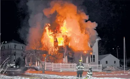  ?? COURTESY DAVID BRYCE ?? Heavy flames caused serious damage to the rectory at St. John the Evangelist Catholic Church in Townsend overnight Monday.