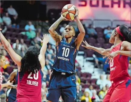  ?? SEAN D. ELLIOT/THE DAY ?? Connecticu­t Sun guard Courtney Williams shoots over the Washington Mystics defense in the second half of Wednesday night’s WNBA game at Mohegan Sun Arena.