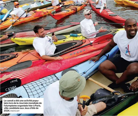  ?? PHOTO AFP ?? Le canoë a été une activité populaire lors de la Journée mondiale de l’olympisme organisée hier à Paris, ville candidate aux Jeux d’été de 2024.