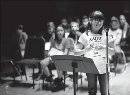  ?? Photos by Hyoung Chang, The Denver Post ?? Diana Navas, a student at Gust Elementary in Denver, competes in Colorado’s third Spanish Spelling Bee on Saturday. The event, held at Kepner Legacy Middle School in Denver, drew nearly 50 students in grades 2-8.