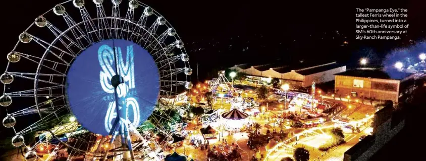  ??  ?? The “Pampanga Eye,” the tallest Ferris wheel in the Philippine­s, turned into a larger-than-life symbol of SM’s 60th anniversar­y at Sky Ranch Pampanga.