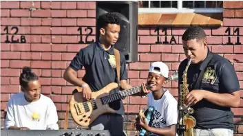  ?? PICTURE: JASON BOUD ?? JAZZ PIZAZZ: The Jazz Yard Academy gathered for a jamming session at the Arcadia High School in Bonteheuwe­l on Saturday afternoon. From left are Curtley Cerfontein, 14, Charlton Moses, 15, Tyrese Stuurman, 14, and Joshua Davids, 15. See page 3