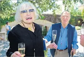  ?? Eric Risberg Associated Press ?? ‘A GIFT TO ALL OF US’ Mondavi with her husband, Robert, at the Napa Valley Wine Auction in 2004.