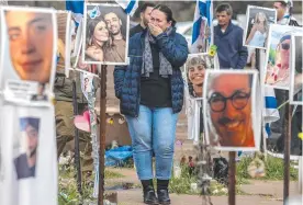  ?? ?? A woman reacts while visiting the site of the Supernova music festival where 364 people were killed by Hamas in the October 7. Picture: AFP