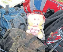  ?? HT PHOTO ?? A soft toy lies amid the victims’ schoolbags near the accident spot in Nurpur on Tuesday. n