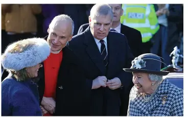  ??  ?? Looking anxious, Andrew with his mother and Sandringha­m rector Canon Jonathan Riviere