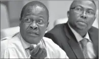  ?? Picture: TREVOR SAMSON ?? ROADBLOCK: Brian Molefe, left, flanked by Siyabonga Gama, says the eurozone crisis is a risk to Transnet’s infrastruc­ture plan.