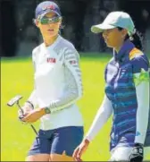  ??  ?? Leader Nelly Korda of USA (left) and Aditi Ashok during the th round of the women's golf in Tokyo on Friday.