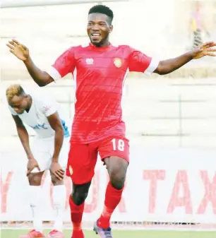 ??  ?? Wikki Tourists striker, Nafiu Kabuga celebrates after scoring one of his goals against Rivers United last Sunday in Jos