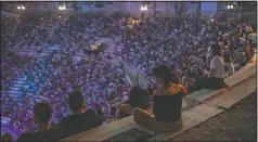  ??  ?? Spectators listen to a concert at the Odeon of Herodes Atticus in Athens.