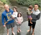  ??  ?? Jon Burke, daughters Sophie and Isla, and Rob Boyd with son Logie, check out the eels.