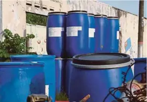  ??  ?? Twenty containers containing toxic chemicals were found in Kampung Desa Melayu, Pasir Gudang, yesterday.