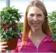  ??  ?? Chandra Bierhuizen with Ardisia plants for Christmas.