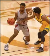  ?? RICH HUNDLEY III — FILE PHOTO — FOR THE TRENTONIAN ?? Rider’s Allen Powell, left, had a career-high 18 points in Saturday’s game.