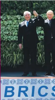  ??  ?? Leaders of BRICS countries, from left, Brazilian President Michel Temer, Russian President Vladimir Putin, Indian Prime Minister Narendra Modi, Chinese President Xi Jinping, and South African President Jacob Zuma raise their hand for a group photo at...