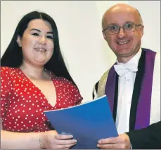  ??  ?? Shannon Maclean receives her award from UHI vice principal Professor Neil Simco.