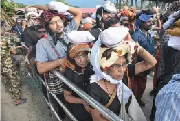  ?? — PTI ?? Elderly women arrive at Sabarimala Temple, in Pathanamth­itta district, on Monday. This is the second time the hill temple will open for ' darshan' after the Supreme Court allowed entry of women of all age groups into it.