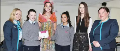  ??  ?? Cáit Irwin, Siobhan O’ Sullivan, Bank of Ireland, Kanturk surprised student designers Emma O’ Keeffe and Erin Foley from Boherbue Comprehens­ive School, with a precious Silver Ticket securing their place the 2017 Junk Kouture Munster regional . Also...