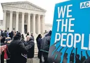  ?? [AP FILE PHOTO] ?? In this Jan. 10 photo, people rally outside of the Supreme Court in opposition to Ohio’s voter roll purges in Washington.