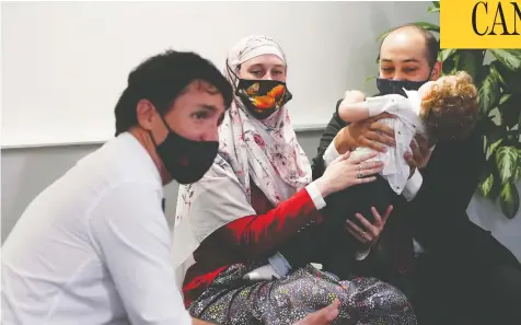  ?? SEAN KILPATRICK / THE CANADIAN PRESS ?? Liberal Leader Justin Trudeau meets with a family and physicians in Halifax during a campaign swing through Nova Scotia on Monday.