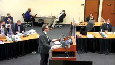  ?? The Associated Press ?? ■ In this image taken from video, defense attorney Eric Nelson questions witness Los Angeles police department Sergeant Jody Stiger, as Hennepin County Judge Peter Cahill presides Wednesday in the trial of former Minneapoli­s police Officer Derek Chauvin at the Hennepin County Courthouse in Minneapoli­s. Chauvin is charged in the May 25, 2020, death of George Floyd.