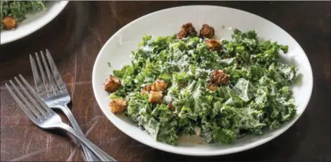  ?? JOE KELLER — AMERICA’S TEST KITCHEN ?? This recipe for Kale Caesar Salad appears in the cookbook “Nutritious Delicious.”