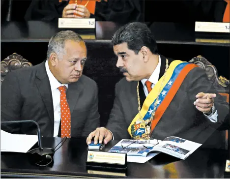  ?? ARIANA CUBILLOS/AP ?? President Nicolas Maduro, right, speaks with socialist party boss Diosdado Cabello last January at an annual ceremony marking the judicial year, in Caracas, Venezuela.