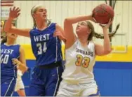  ?? PETE BANNAN — DIGITAL FIRST MEDIA ?? Downingtow­n East senior Erin Phelan lays in a shot in the second quarter Monday against the Whippets.