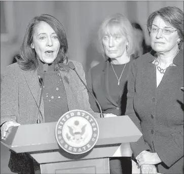  ?? Chip Somodevill­a Getty Images ?? SENS. MARIA Cantwell, left, and Orrin G. Hatch introduced a bill last March that would expand the federal tax credit program, with the hopes of boosting housing production beyond any deficit created from tax cuts.