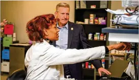  ?? COURTESY ?? St. Vincent de Paul Georgia Executive Director Mike Mies checks out the organizati­on’s community pharmacy that provides free prescripti­on meds to under- or uninsured Georgians. “We go in not as a service provider but as neighbors and friends.”