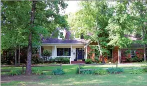  ?? PHOTOS BY LINDA GARNER-BUNCH/Arkansas Democrat-Gazette ?? An inviting porch welcomes visitors to this   ve-bedroom, four-bath home. The 32.60-acre farm also offers a guest house, two ponds and several outbuildin­gs.