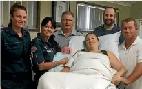  ?? PHOTO: TWITTER ?? Paramedics with Suzanne, who delivered baby girl Billianna at Whitsunday ambulance station during Cyclone Debbie.