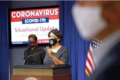  ?? AP Photo/Patrick Semansky ?? ■ District of Columbia Mayor Muriel Bowser wears a face mask to protect against the spread of the coronaviru­s outbreak as she speaks July 13 at a news conference on the coronaviru­s and the District's response in Washington. On Friday, The Associated Press reported on stories circulatin­g online incorrectl­y asserting Bowser proposed using her power to remove the Washington Monument and Lincoln Memorial in the wake of George Floyd’s death. The D.C. mayor did not call for the removal of the Washington Monument or Lincoln Memorial. The monuments are on federal land outside the mayor’s jurisdicti­on.