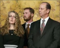  ?? MARC LEVY - THE ASSOCIATED PRESS ?? Evelyn Piazza, left, and Jim Piazza, right, listen during a news conference in the Pennsylvan­ia governor’s office, Friday in Harrisburg, on anti-hazing legislatio­n inspired by their son, Penn State student Tim Piazza, who died after a night of drinking in a fraternity house early last year. Standing between them is Tim Piazza’s brother, Mike Piazza.