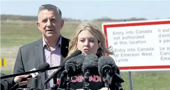  ?? TREVOR HAGAN/THE CANADIAN PRESS ?? Conservati­ve MPs Ted Falk, left, and Michelle Rempel speak during a press conference to discuss the increase of illegal crossings near Emerson, Man., Friday.