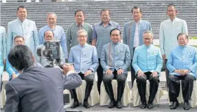  ?? APICHART JINAKUL ?? Prime Minister Prayut Chan-ocha takes part in a group photo with ministers, Thai ambassador­s in neighbouri­ng countries as well as governors of 32 border provinces at the Foreign Ministry yesterday.