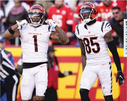  ?? PAUL SANCYA/AP ?? Ja’Marr Chase (left) and Tee Higgins made the Bengals one of five teams with multiple 1,000-yard receivers in the regular season.