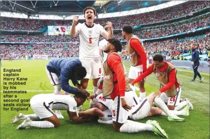  ??  ?? England captain Harry Kane is mobbed by his teammates after a second goal seals victory for England This week’s games