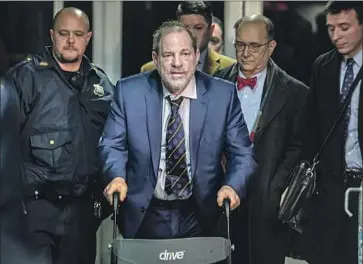  ?? Bebeto Matthews Associated Press ?? HARVEY WEINSTEIN leaves court in New York after prosecutor­s gave closing arguments in his rape trial. Defense attorneys implored the jury to focus on the evidence rather than the maelstrom of negative press.