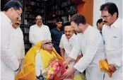  ?? — PTI ?? Congress vice-president Rahul Gandhi greets DMK chief M. Karunanidh­i on his 94th birthday at his Gopalapura­m residence in Chennai on Sunday.