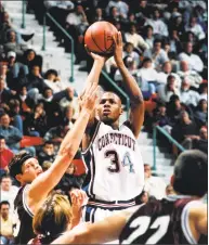  ?? Robert W Stowell Jr / Getty Images ?? UConn's Ray Allen shoots over defense in 1994.