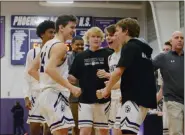  ?? OWEN MCCUE - MEDIANEWS GROUP ?? Phoenixvil­le’s Clay Kopko, left, celebrates with the Phantoms bench after Thursday’s win against Pottstown.