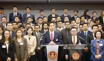  ?? — AFP photo ?? Pita Limjaroenr­at (centre) attends a press conference at the Thai parliament in Bangkok, after Thailand’s Constituti­onal Court court ordered Pita and MFP to stop campaignin­g for lese-majeste reform immediatel­y.