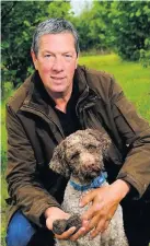  ??  ?? Farmer Mike Collison, 59, with his truffle-sniffing dog Oscar