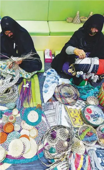  ?? Ahmed Ramzan/ Gulf News ?? Women work on traditiona­l handicraft­s at Fujairah stand on the third day of the Arabian Travel Market 2017 at the Dubai World Trade Centre.