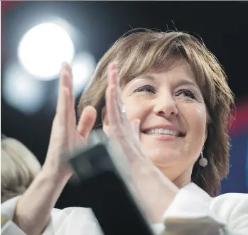  ?? DARRYL DYCK/THE CANADIAN PRESS ?? Premier Christy Clark applauds as she’s joined on stage by party candidates before delivering a keynote address at the B.C. Liberal party convention in Vancouver on Sunday.